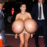 Scarlett J. posing with her huge silicone boobs out in public